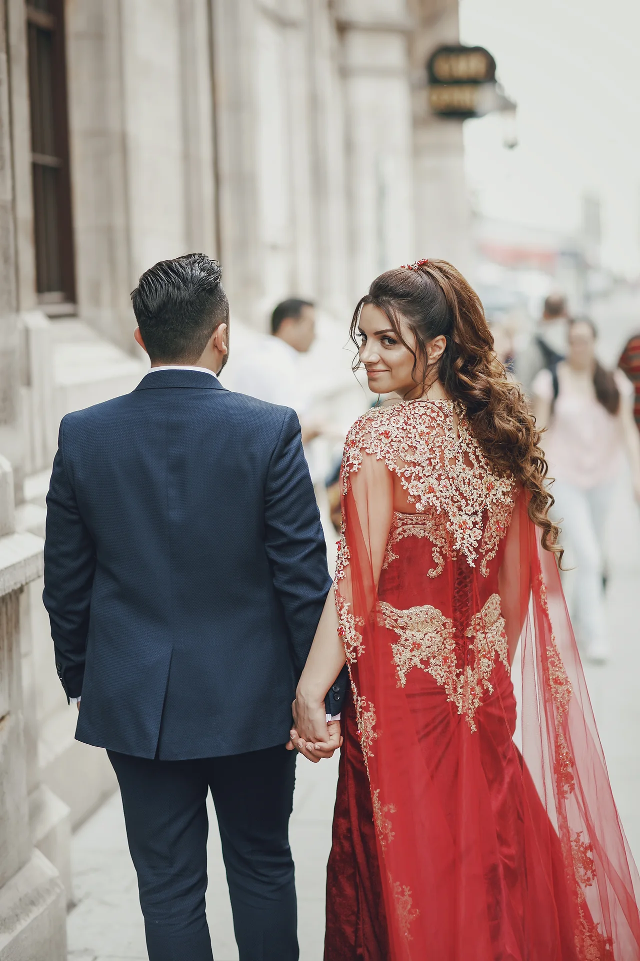 Wedding couple walking together in the city